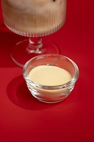A clear bowl filled with instant white powder mix — used in milk teas, smoothies, and dessert drinks