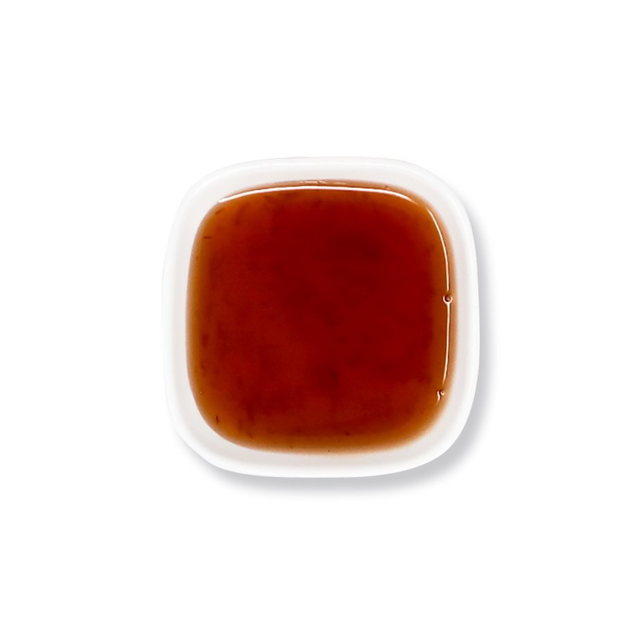Top view of grapefruit syrup – deep amber color with smooth texture.