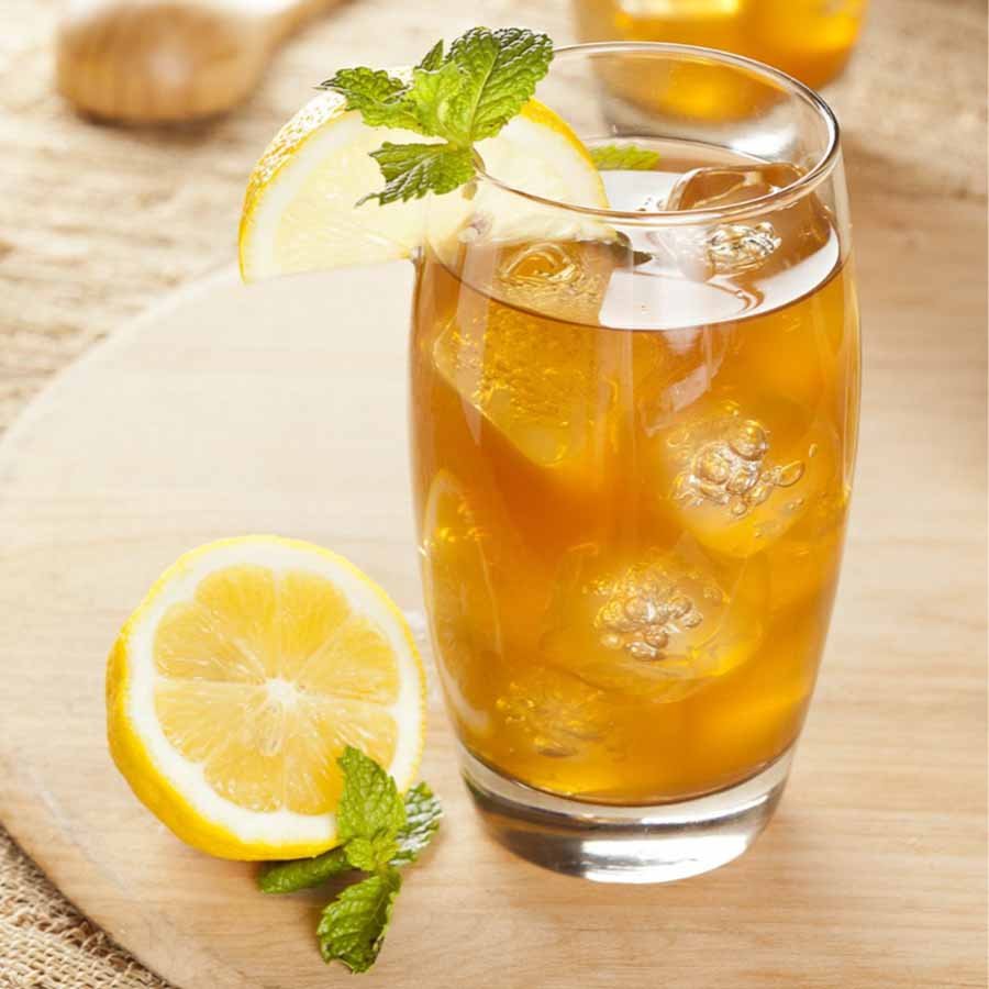 Lemon drink with ice and slices – zesty and cooling beverage option.