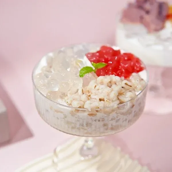 A glass filled with assorted bubble tea toppings including popping boba, jelly, and grains — showcasing diverse B2B applications for OEM factories, yogurt brands, and RTD products