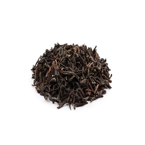 Dry Tie Guan Yin tea leaves – tightly rolled and dark brown.