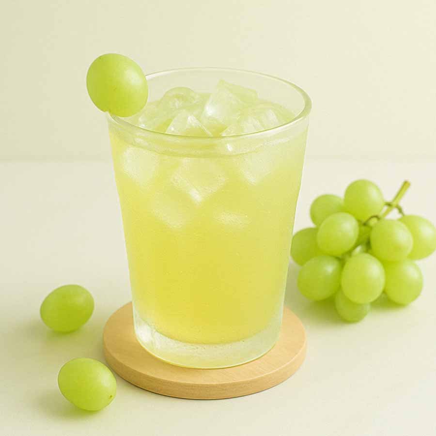 White grape iced drink with pulp and ice – refreshing and perfect for summer.
