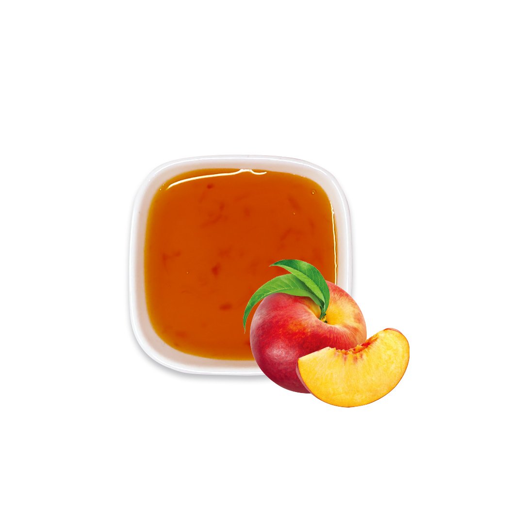 Peach syrup with fresh peach slices – vibrant orange color and fruity aroma for drink base.