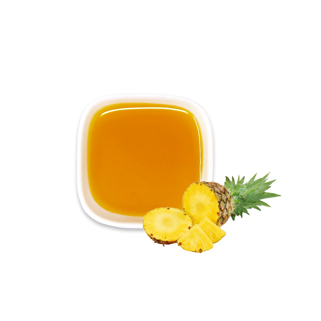 Pineapple syrup with fresh fruit, showing golden hue – ideal for tropical teas and icy drinks.