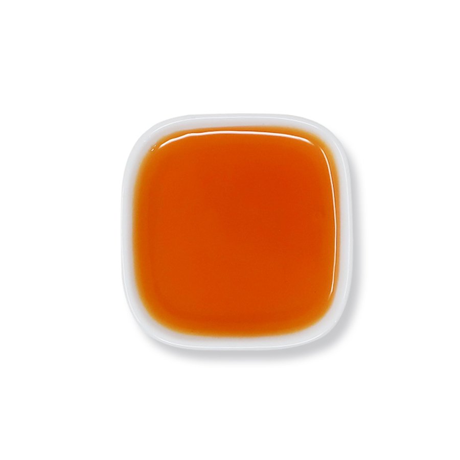 Top view of mango syrup with a rich golden color and smooth consistency.