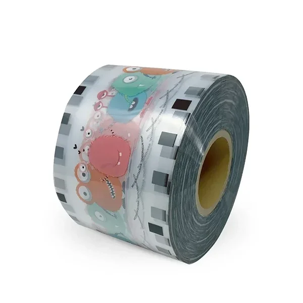 A roll of adhesive tape with colorful cartoon monster illustrations.