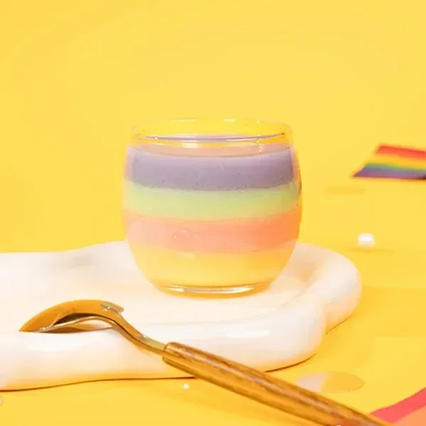 Colorful dessert cup with layered milk cap and powders — showcasing ready-to-mix solutions for beverages and bakery use
