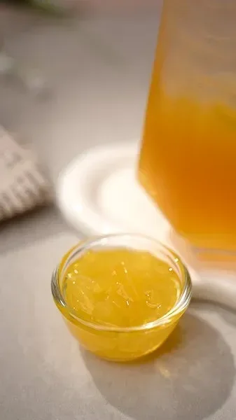 Assorted jelly toppings including nata de coco and konjac, served in a clear glass