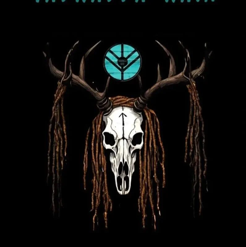 A skull with antlers and dreadlocks under a circular blue clock.