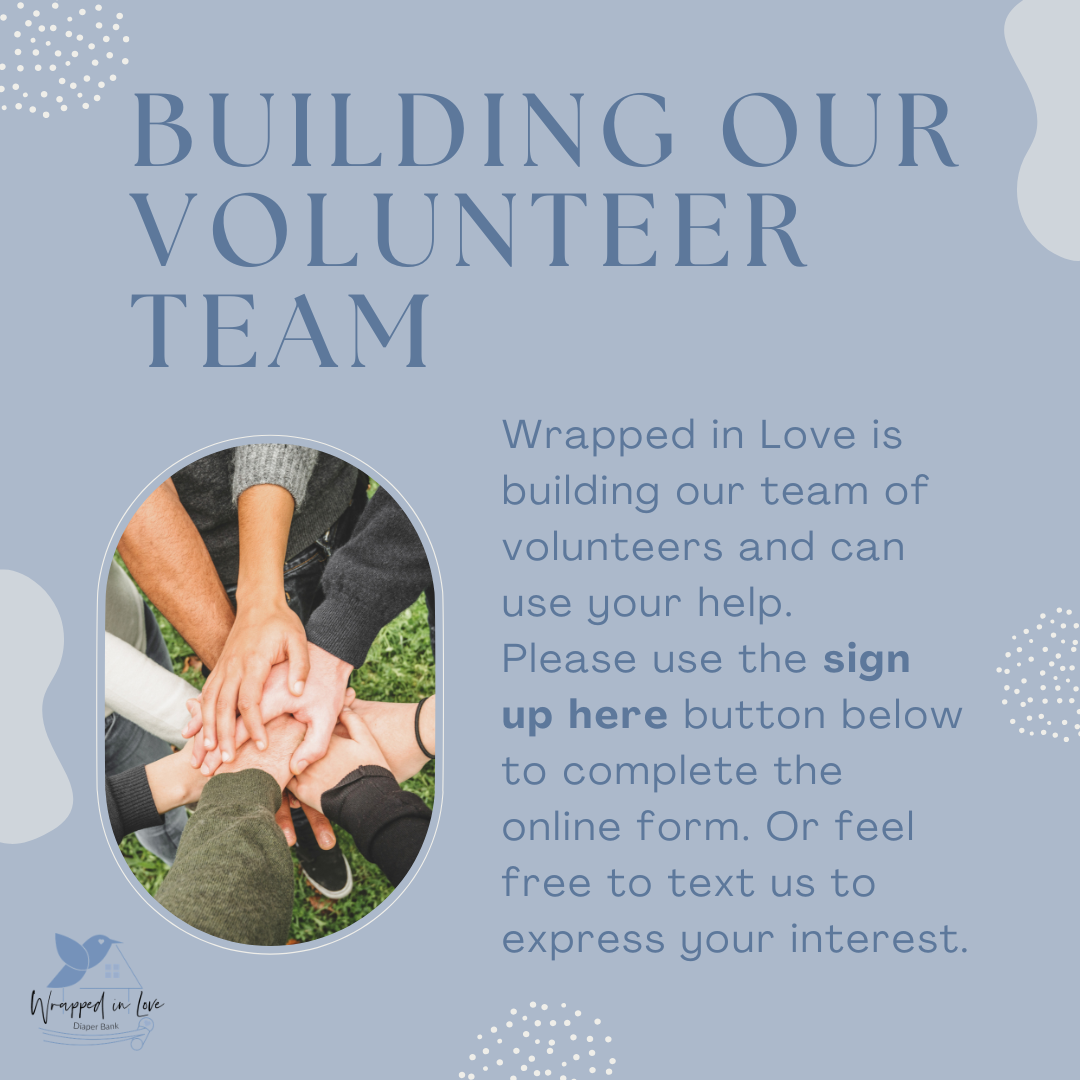 A digital poster for a volunteer team called 'Wrapped in Love' features the title 'Building Our Volunteer Team' and a photo of hands stacked together in a circle, symbolizing teamwork and unity. The background is light blue with decorative dotted patterns and a small house logo with a leaf in the bottom right corner.