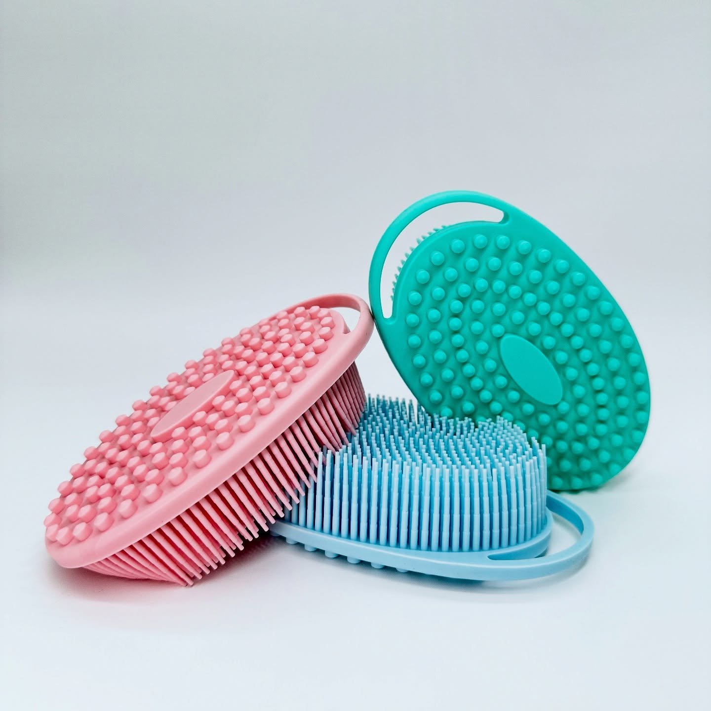 Discover the ultimate in skin pampering with the Silicone Serenity Trio. This luxurious set of three silicone body scrubbers is crafted to provide a gentle yet effective exfoliation, leaving your skin smooth, soft, and glowing. Gentle enough for al