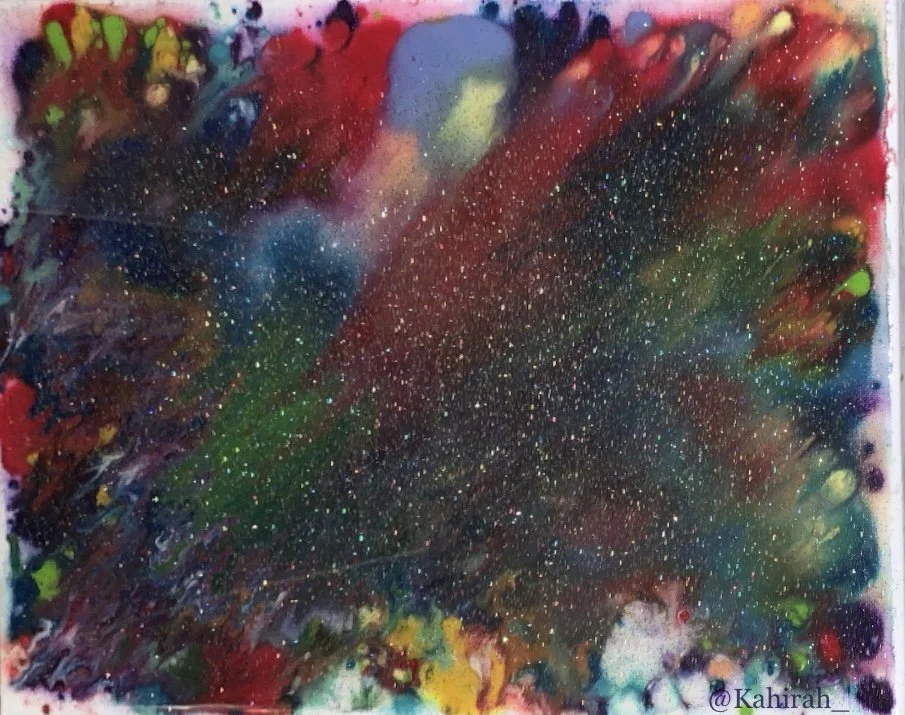 Abstract colorful space-themed painting with splatters of stars, nebulae, and cosmic dust in vibrant colors like red, green, yellow, and blue.