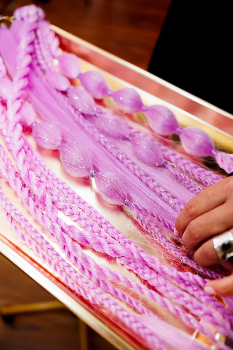 pink braids in a mirror