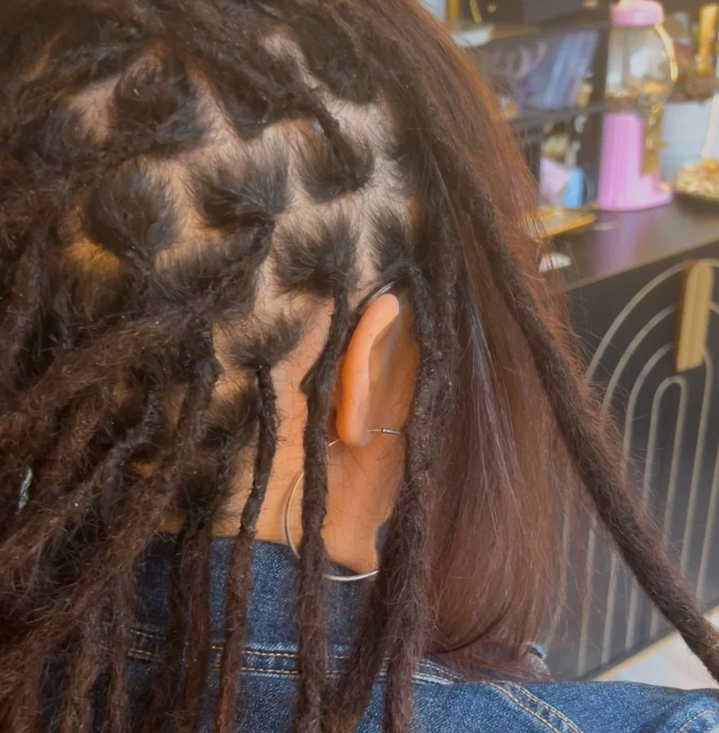 a child with a braid boho hair extension