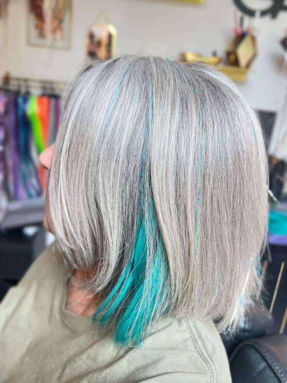 a woman with blue and purple mermaid hair