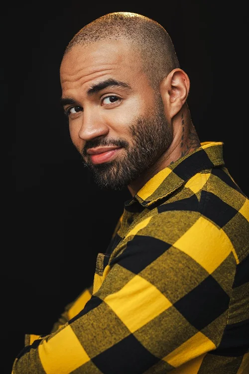Austin actor headshot against a dark background