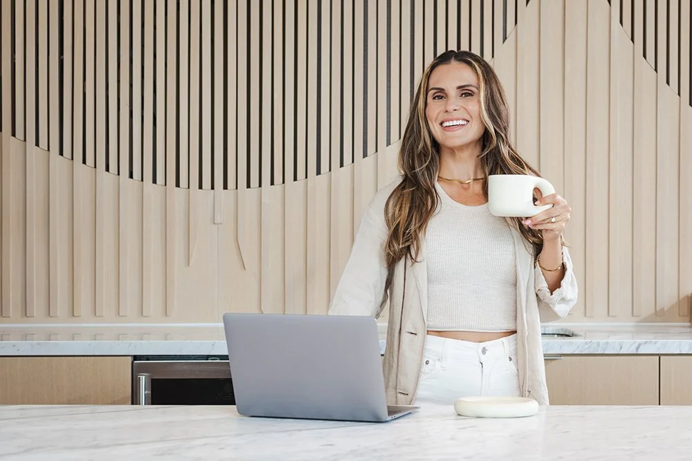 Austin entrepreneur working at a kitchen counter during a lifestyle branding session