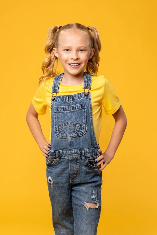 Youth actor portrait against a bright yellow background