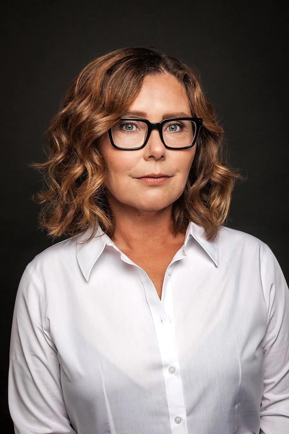 Clean studio portrait of Austin filmmaker Janelle Lee Austin