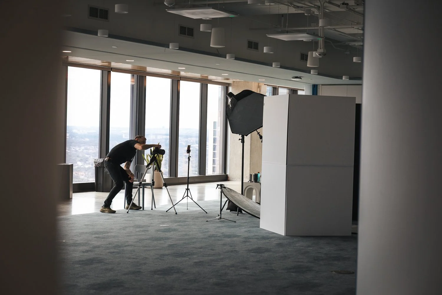 David Price photographing an on-site corporate headshot session in Austin