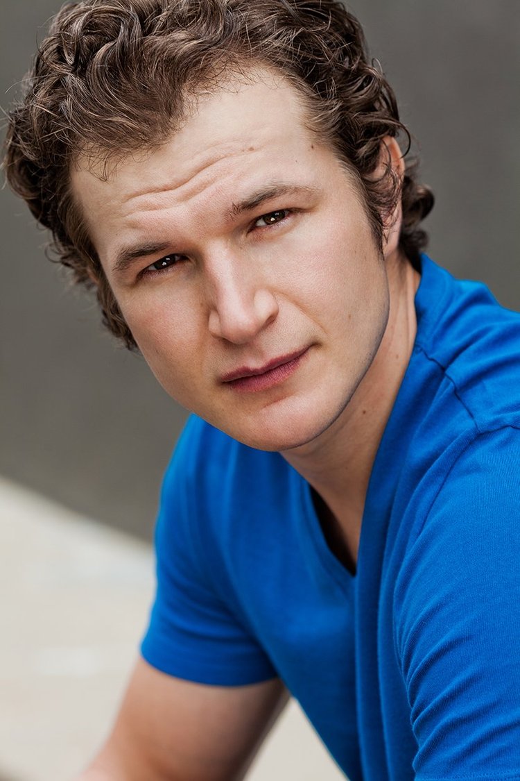 Young Austin actor in a blue shirt
