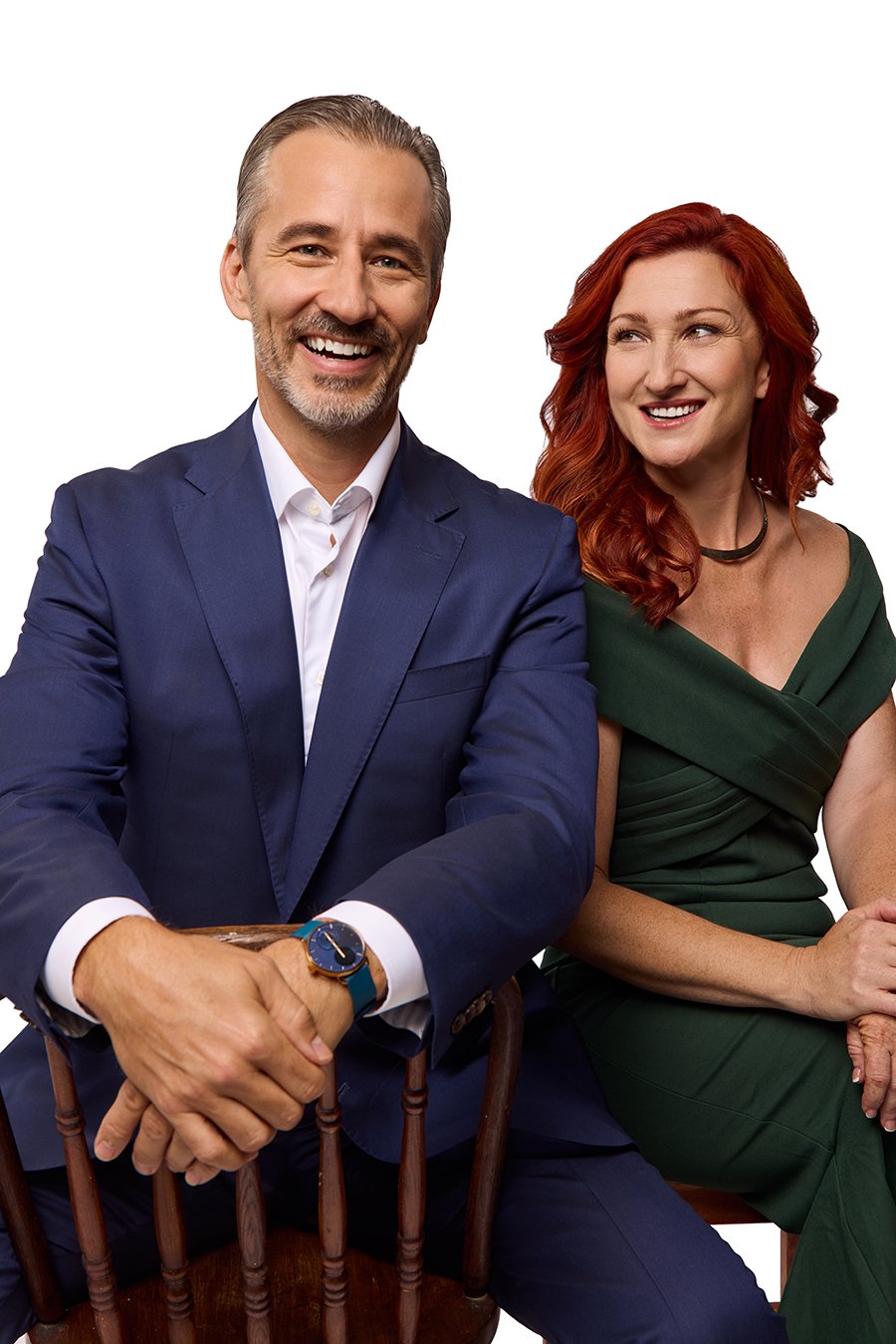 Elegant seated portrait of two Austin real estate professionals