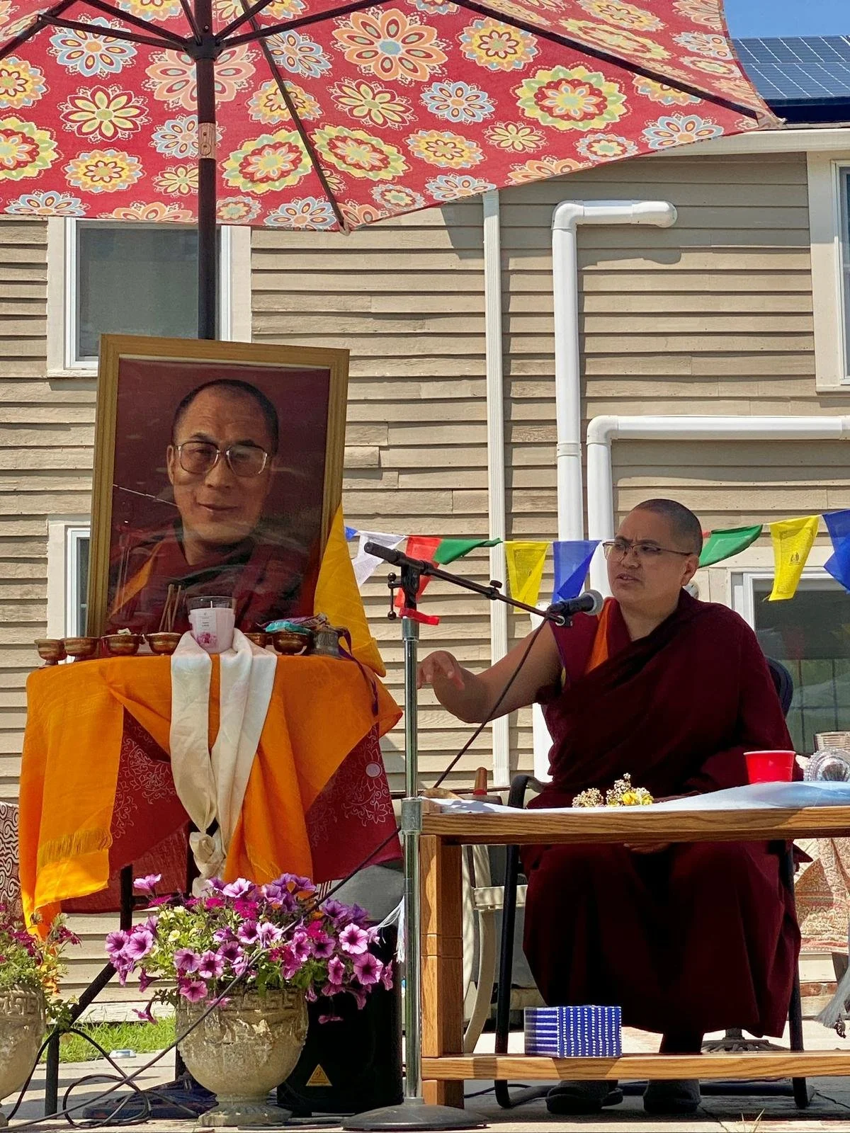 Geshema giving a talk about His Holiness
