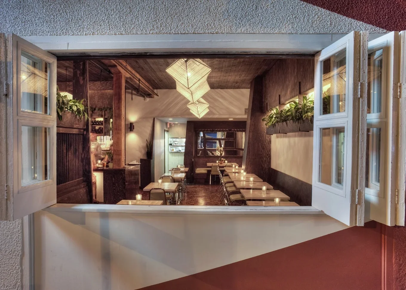 Restaurant interior with chairs, tables, nice lighting.