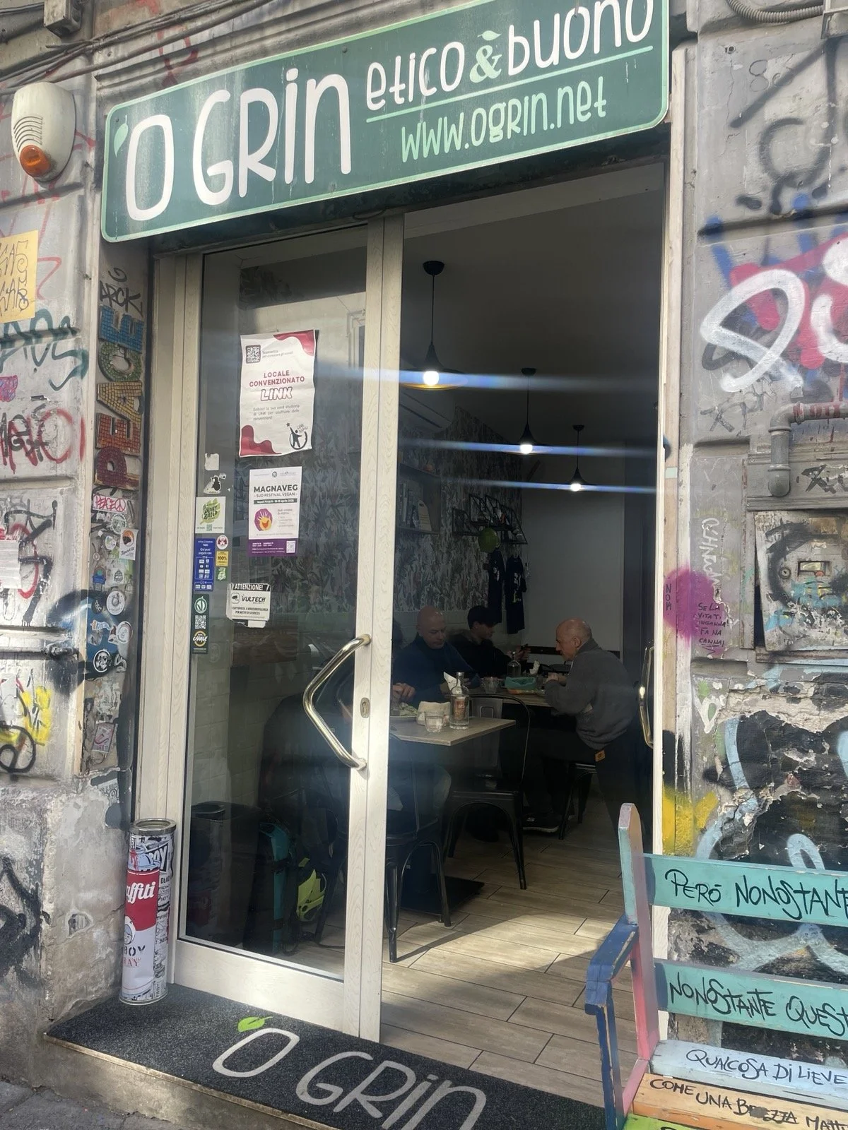 Small vegetarian restaurant exterior in Naples, Italy
