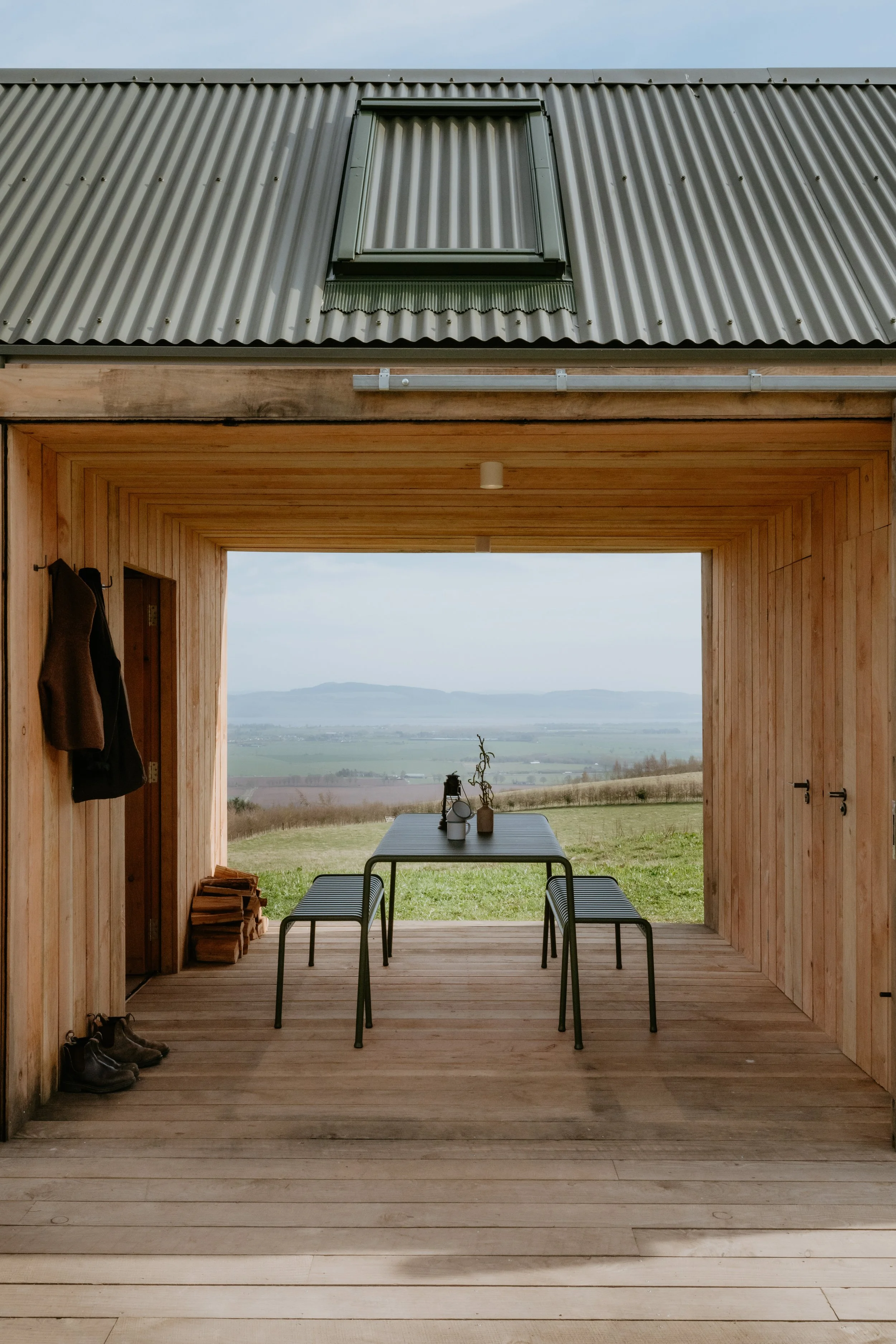 A brilliant covered outside space with large sliding doors that can be pulled across to create another room thats protected from the wind. 