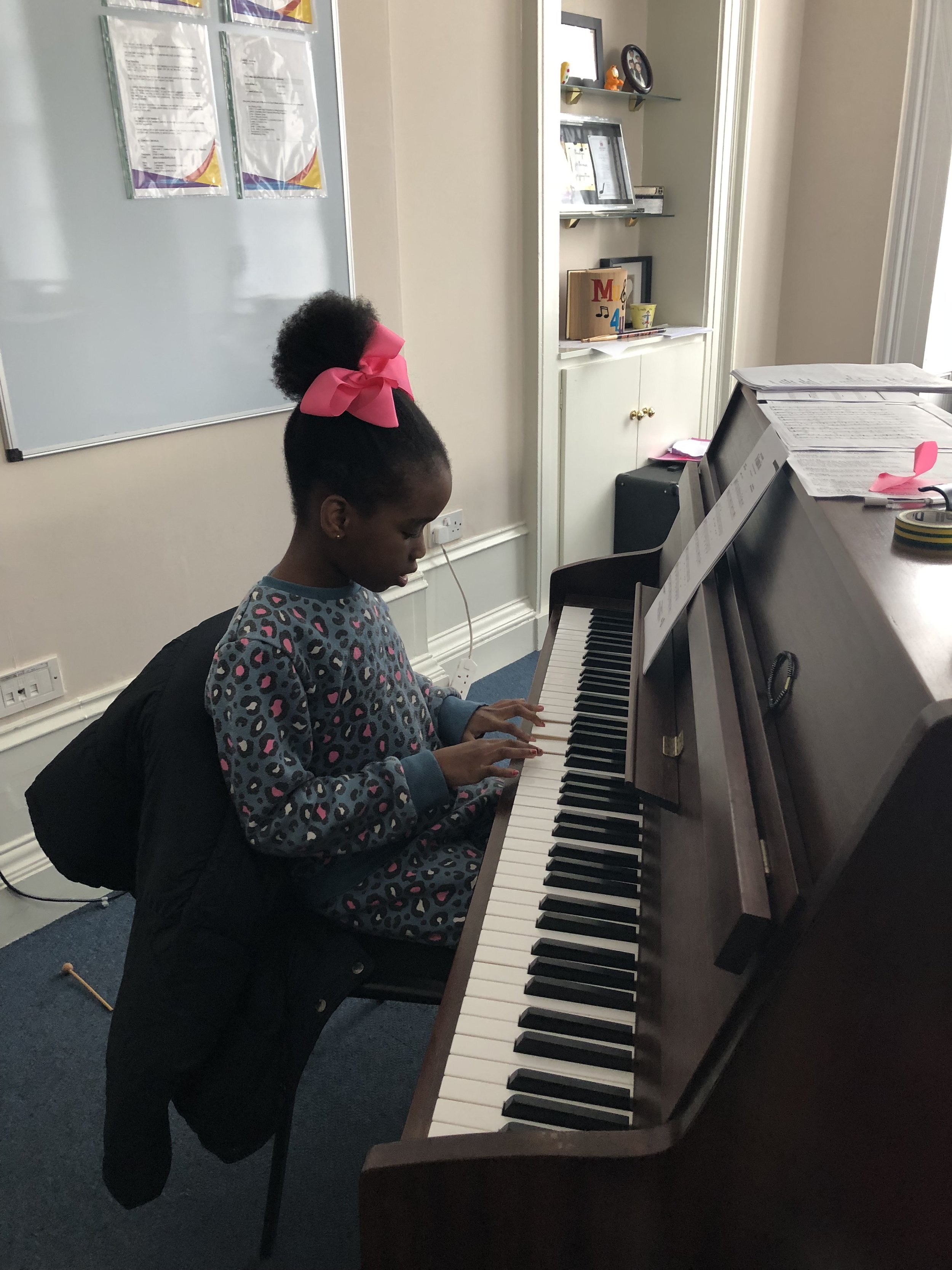 Emmanuella Playing piano.JPG