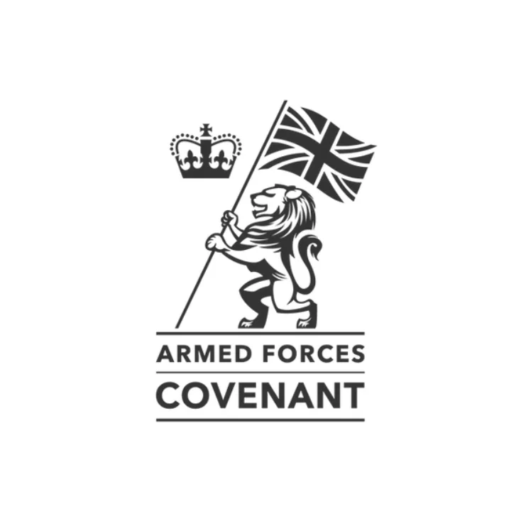 Logo of the Armed Forces Covenant featuring a lion holding a Union Jack flag and a crown above