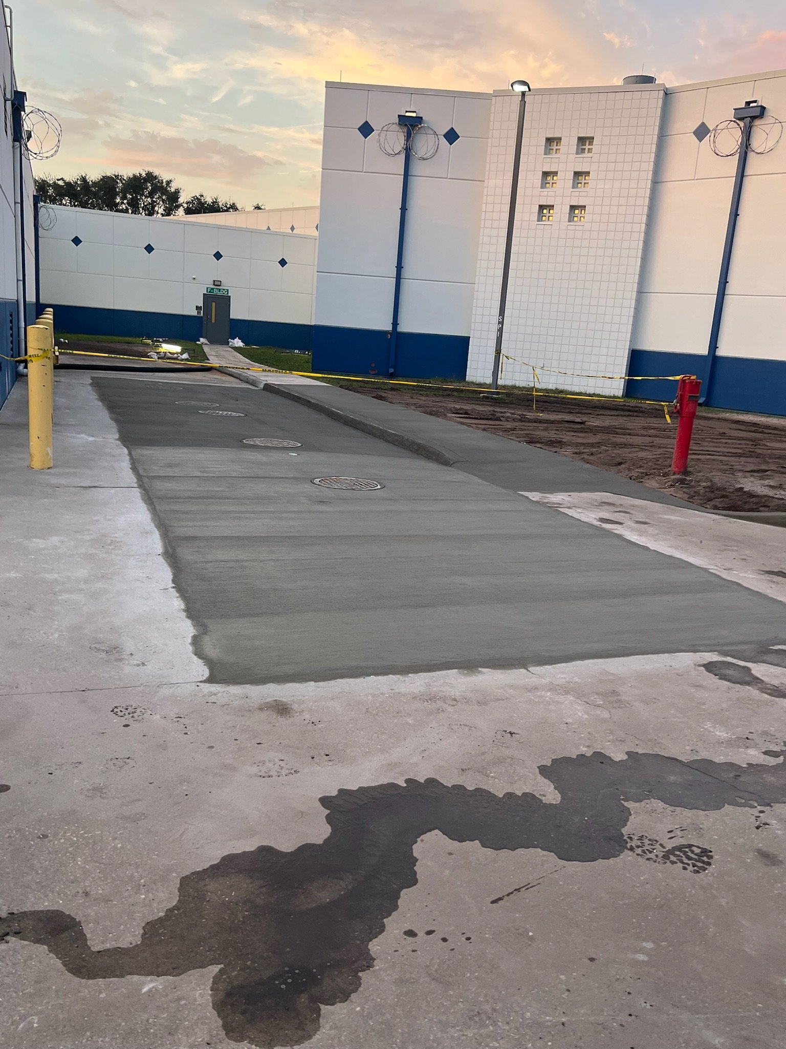 Completed concrete pourback and commercial flatwork by Sterling Concrete Cutting.