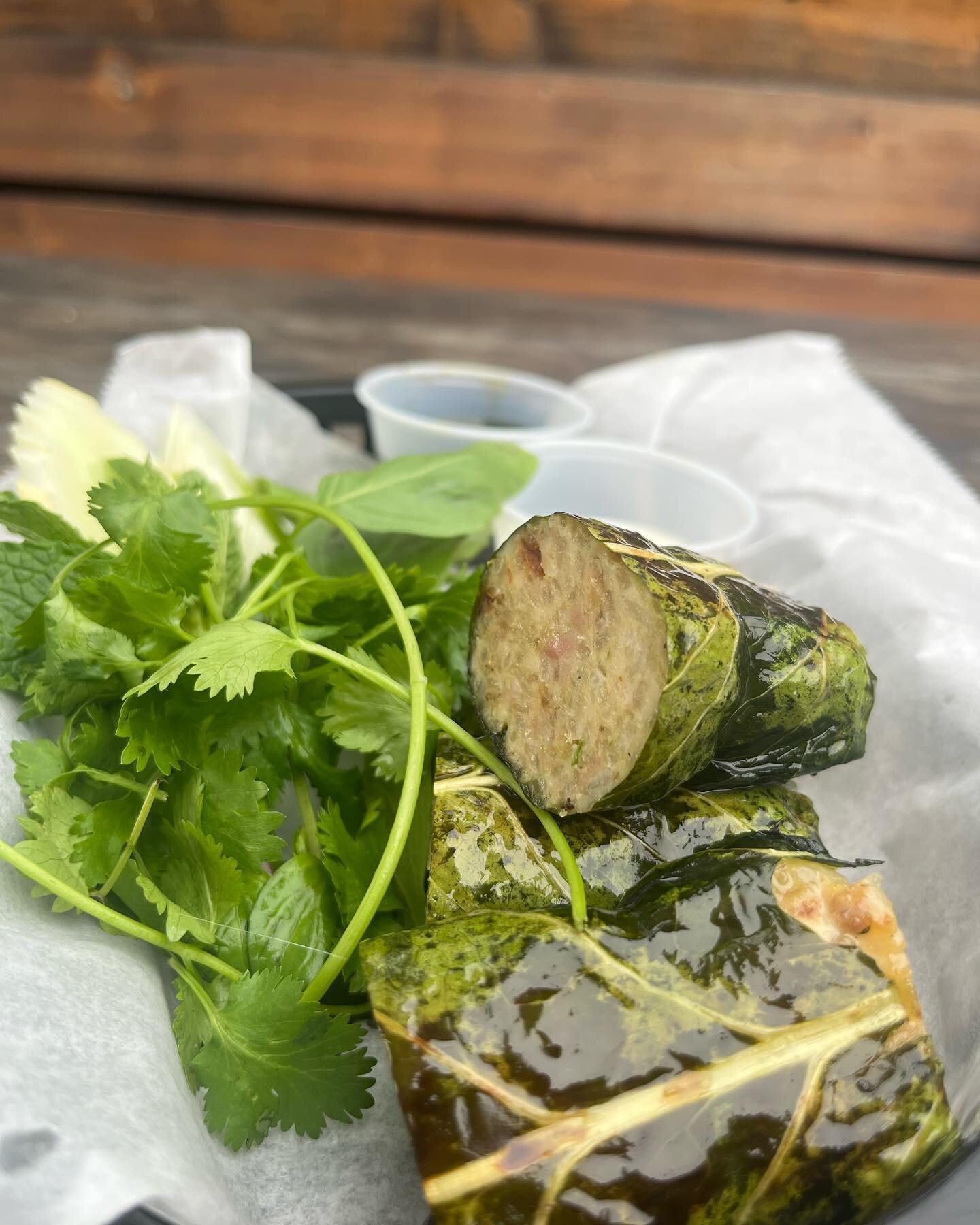 Thai Garlic Chicken Sausage Wrapped in Collard Greens.
Finished On The Grill and Served With Herbs, Ginger Lime Dressing &amp; Nam Prik Pao. 
Same Same but Different
Open tonight till 9!