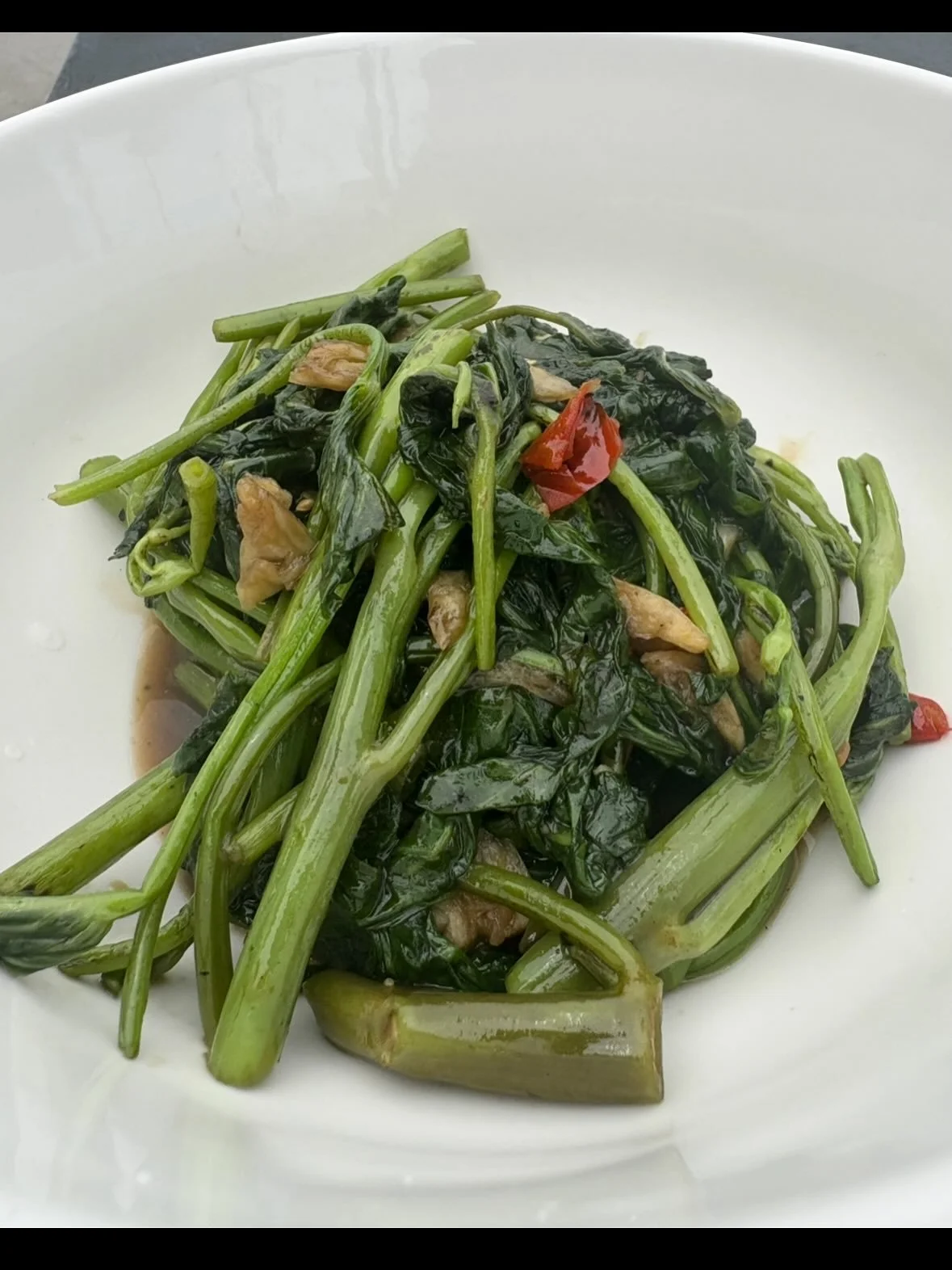 Morning glory is back and boy are we so happy. One of our favorite dishes we serve at the shop. This is a very special dish to us, one made possible by the lovely humans at @growingtogetherfarmersmarket who grow the water spinach for us. A wonderful 