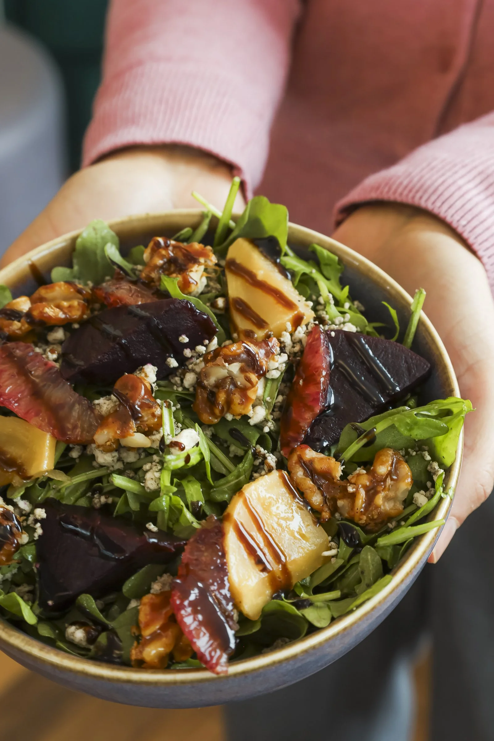 Seasonal salad with beets, citrus, candied walnuts, and balsamic glaze served at a Montreal restaurant in Old Montreal, capturing the fresh flavors and local atmosphere of a vibrant Old Montreal pub.
