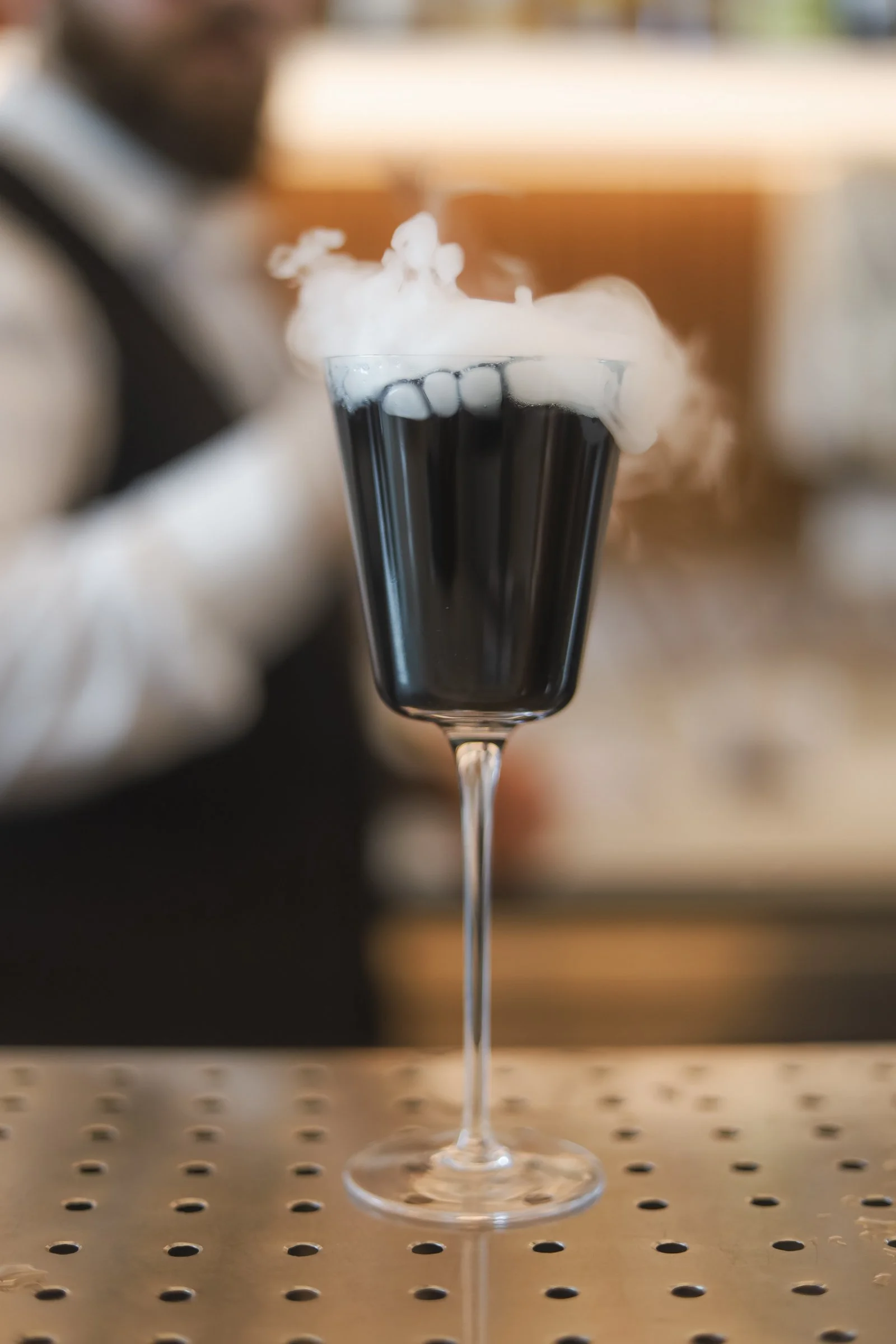 Signature smoked cocktail served at a British pub Montreal in Old Montreal, capturing the creative mixology and vibrant Montreal bar atmosphere of a stylish Old Montreal pub.