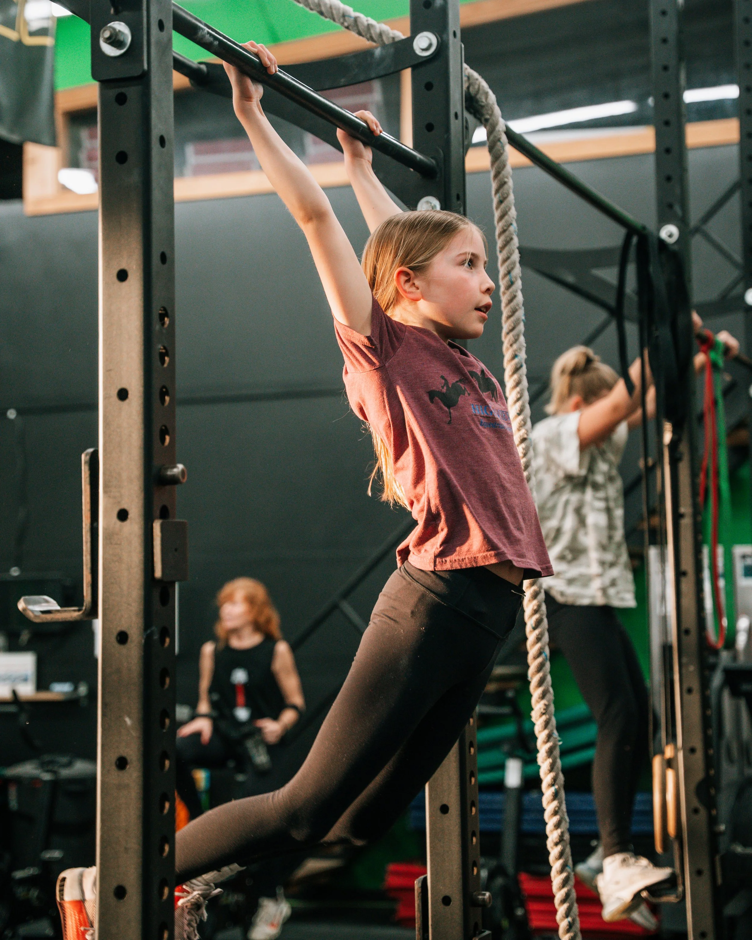  Kid performing a barbell lift
