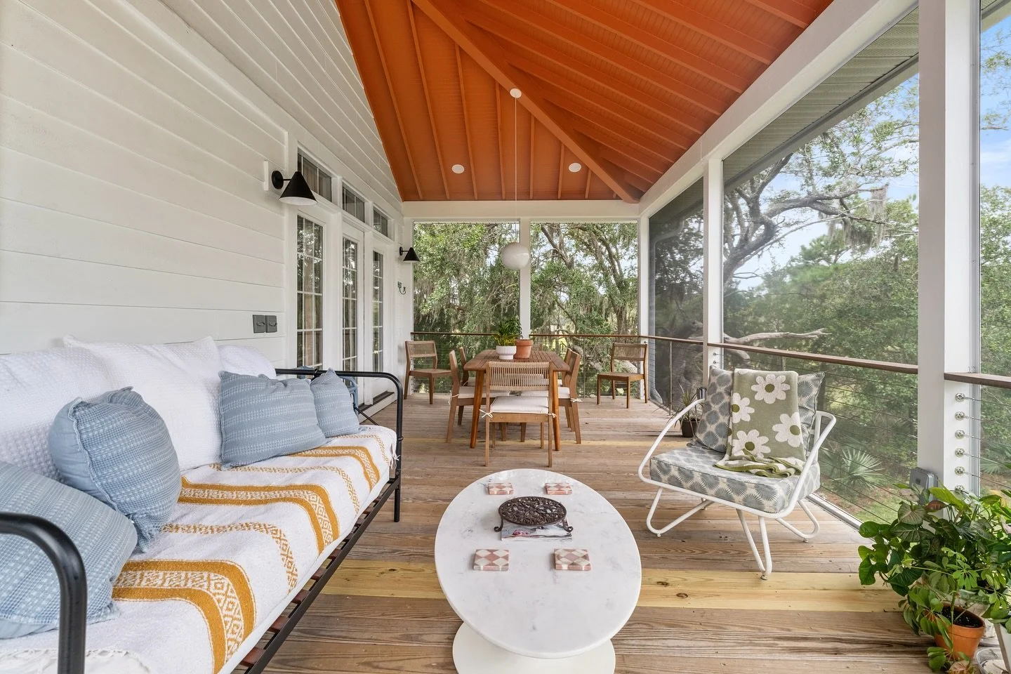 ✨ Porch perfection, Charleston style. ✨ This screened-in retreat by Canter Construction blends Lowcountry views with cozy indoor comfort. From the vaulted ceiling to the natural wood floors, it&rsquo;s the perfect place for morning coffee, evening di