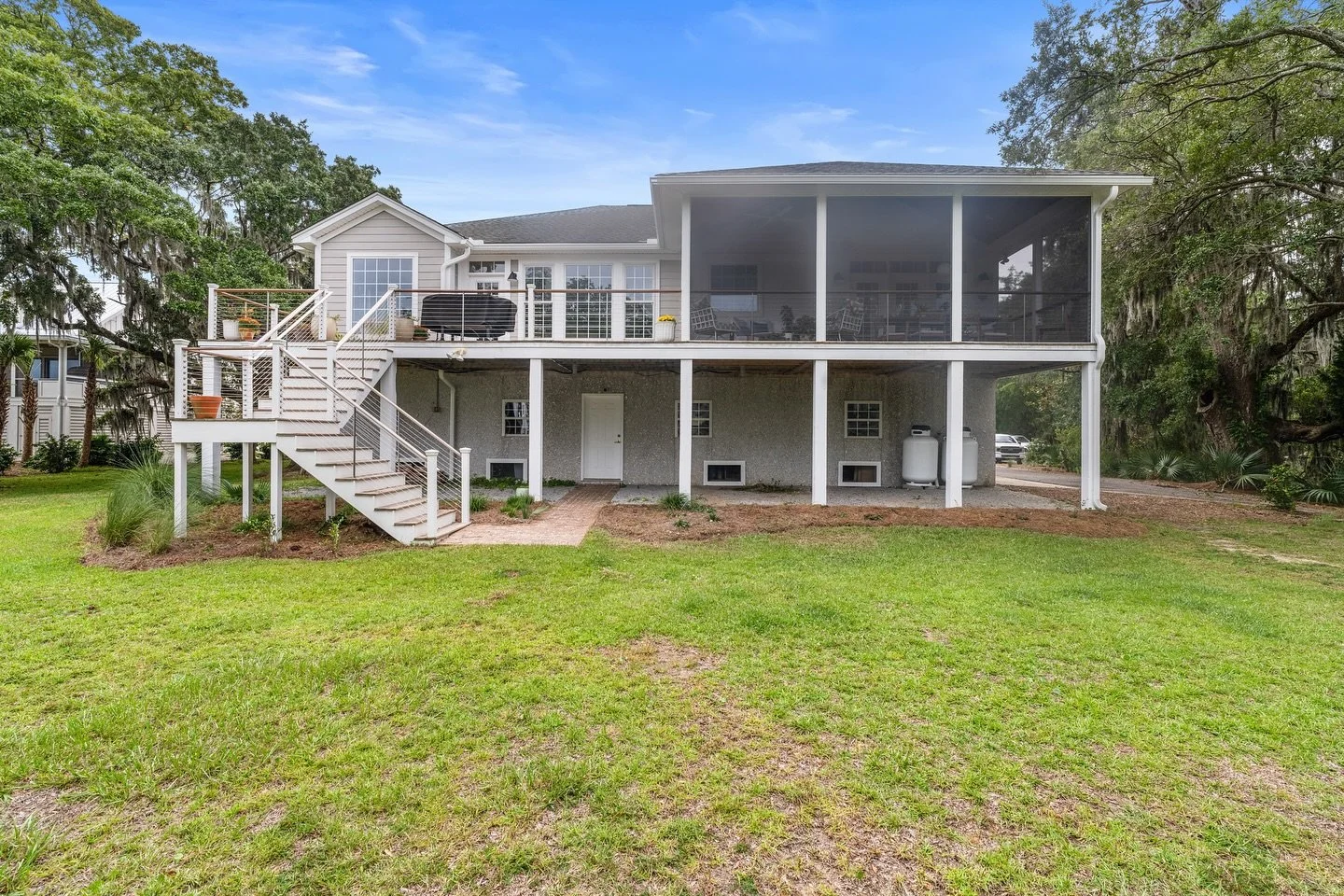 ✨ Outdoor living, Lowcountry style! ✨ Canter Construction transformed this home with a custom screened-in porch and elevated deck &mdash; the perfect blend of coastal charm and modern functionality. From relaxing mornings with coffee to evenings host