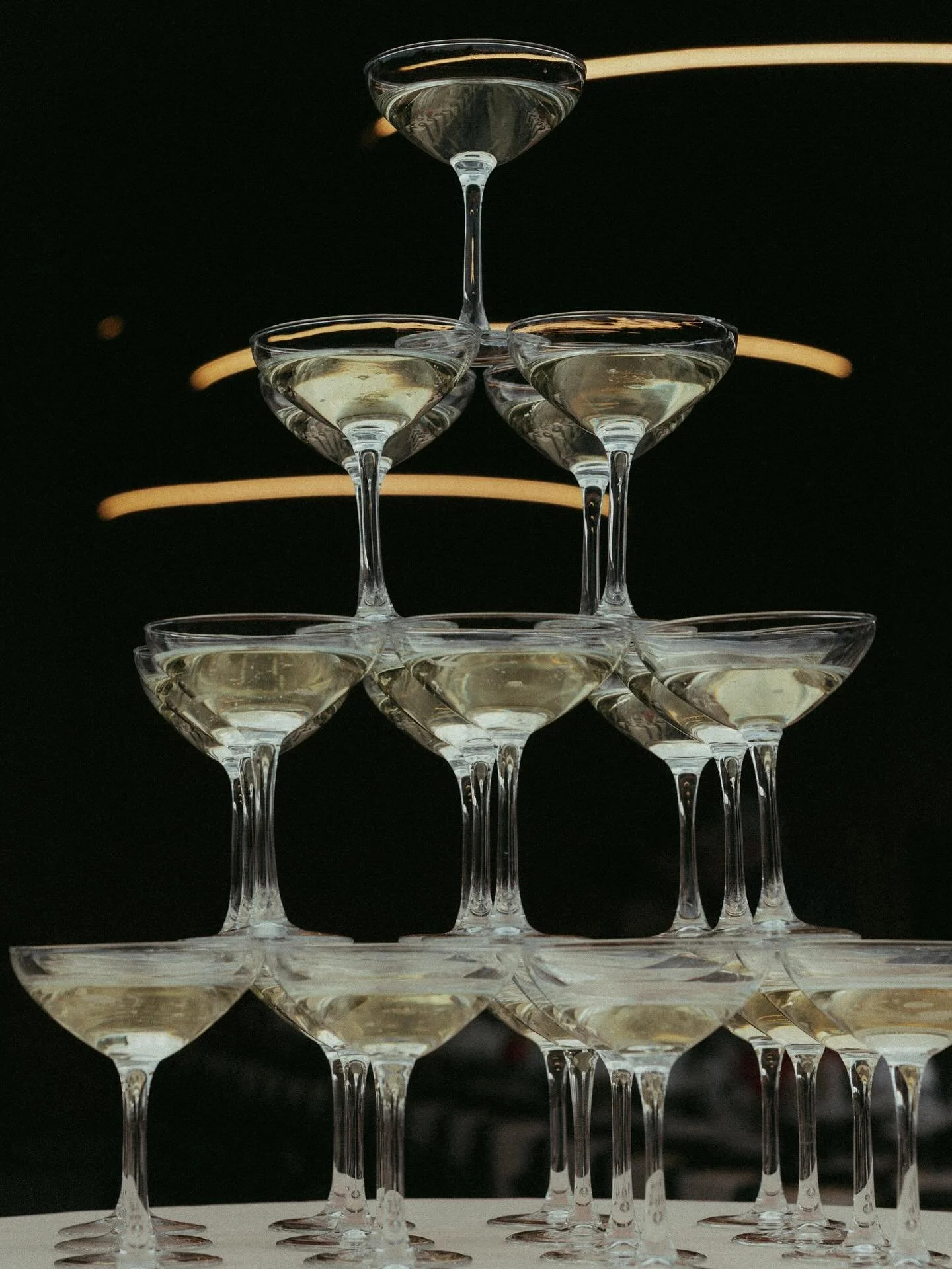 Look closely… what do you see?
The glasses are different sizes and lengths… And yes, the rack of rentals were delivered this way, which made our champagne tower for this couple difficult to build, but with just the right effort, balanc