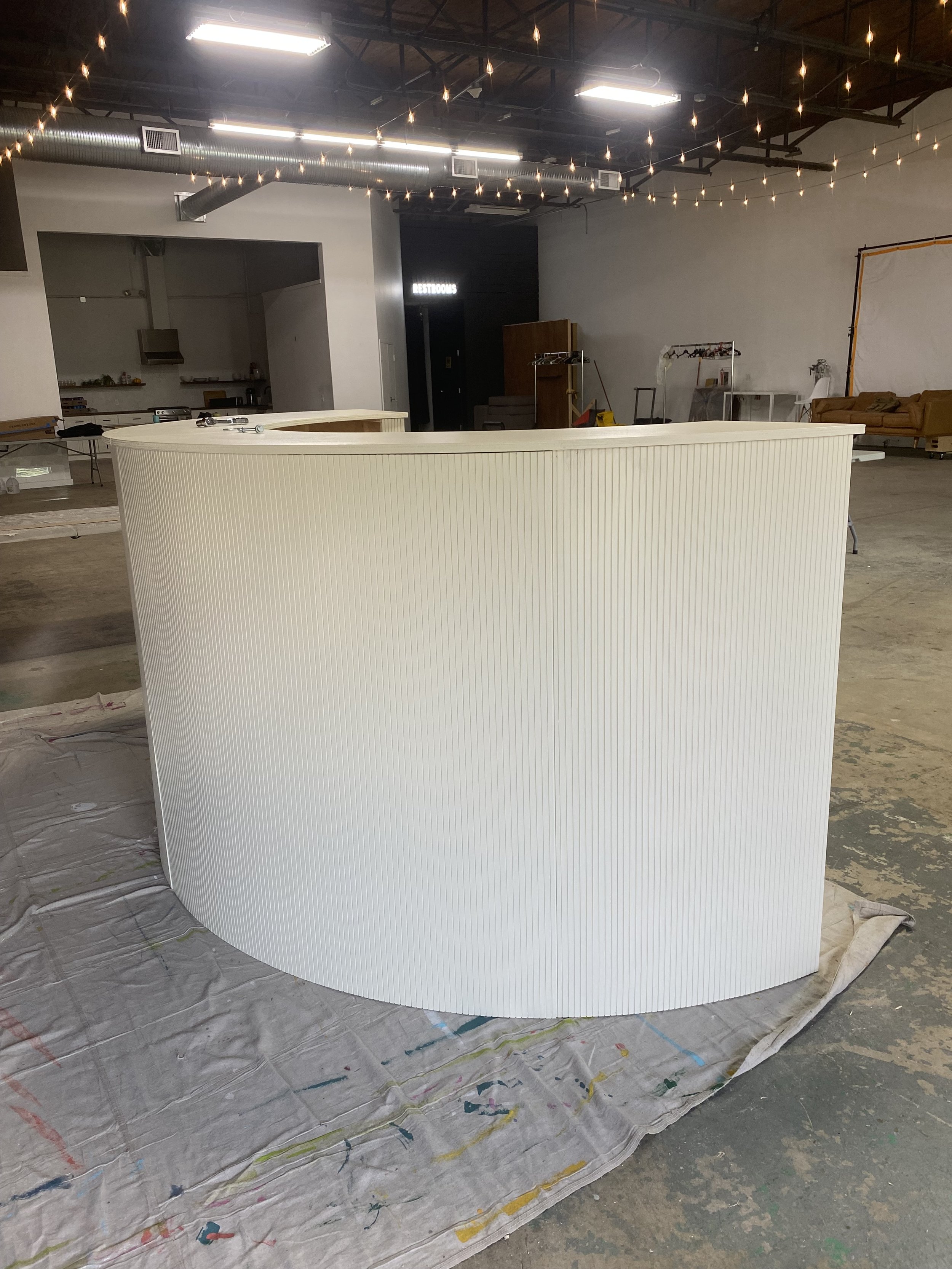 Eido Bar Company’s half-moon mobile bar setup event-ready display.