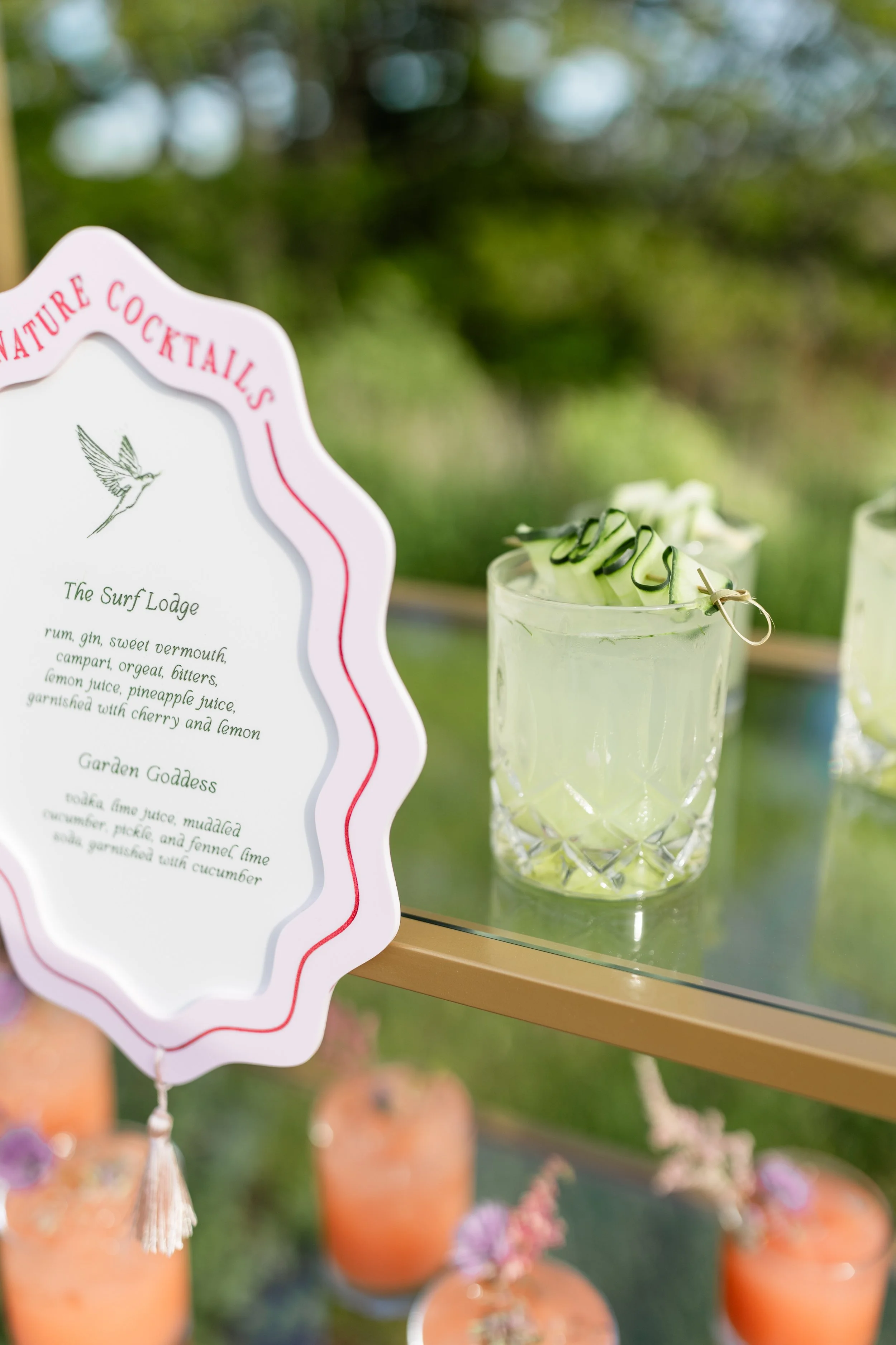 Sustainable organic cocktails by Eido Bar Company, displayed with fresh herbs, citrus, and natural ingredients.