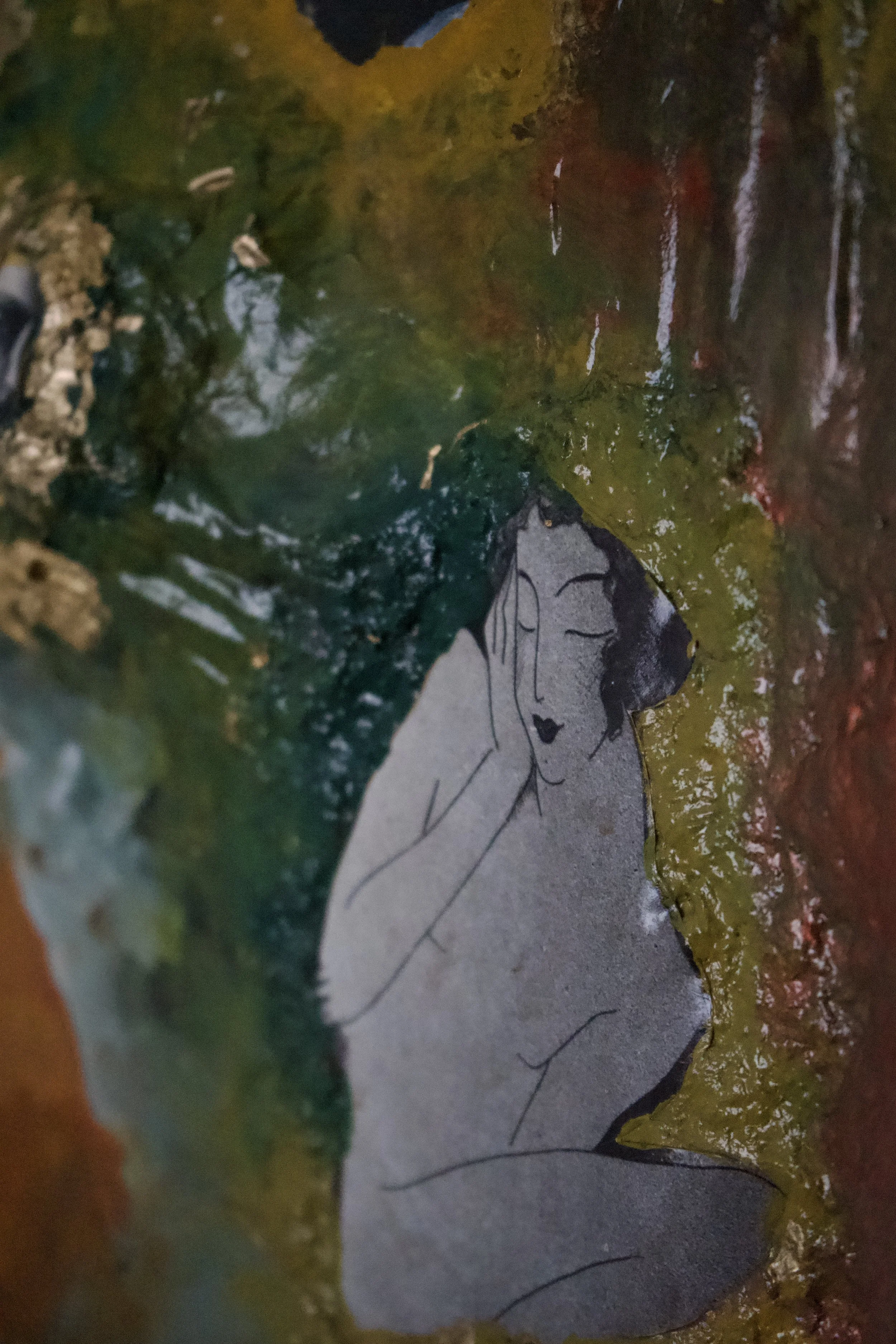 A small illustrated woman with closed eyes and dark hair, resting her face in her hand, surrounded by colorful textured paint with green, yellow, and red hues.