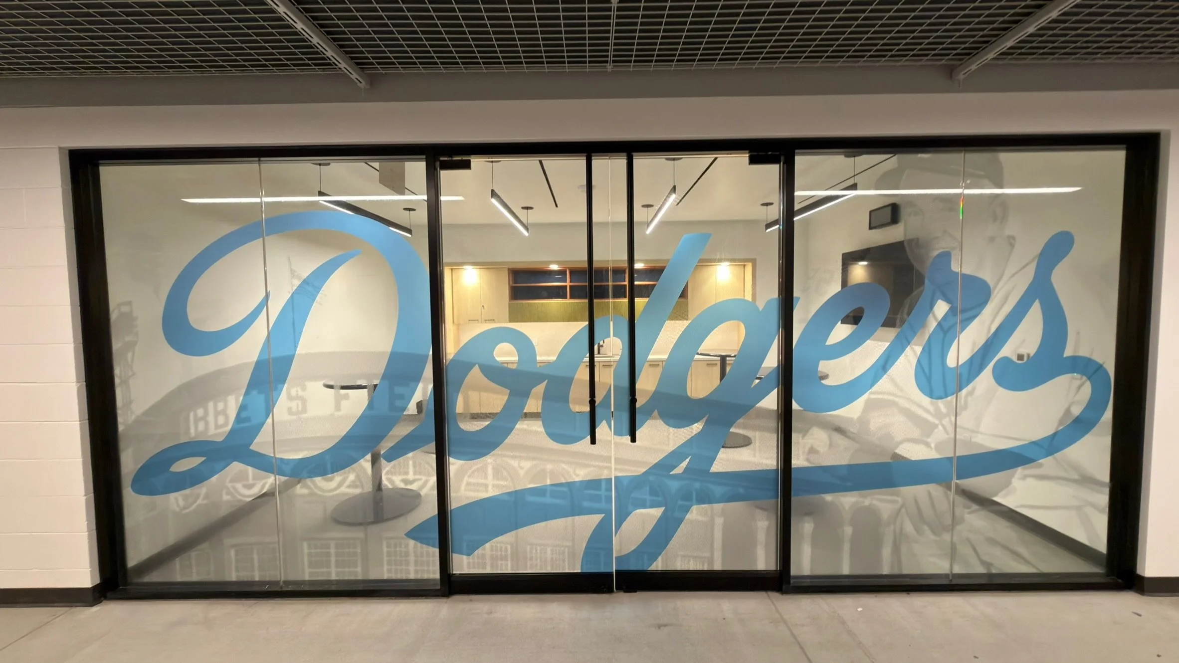 Custom clear printed decorative window film installation completed for Buzzers Stadium in Ontario, California.