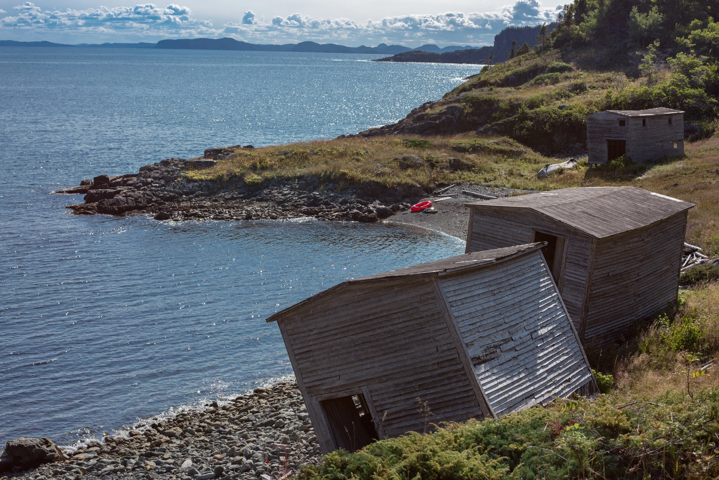Flakes and boathouses at an emptied Newfoundland outport