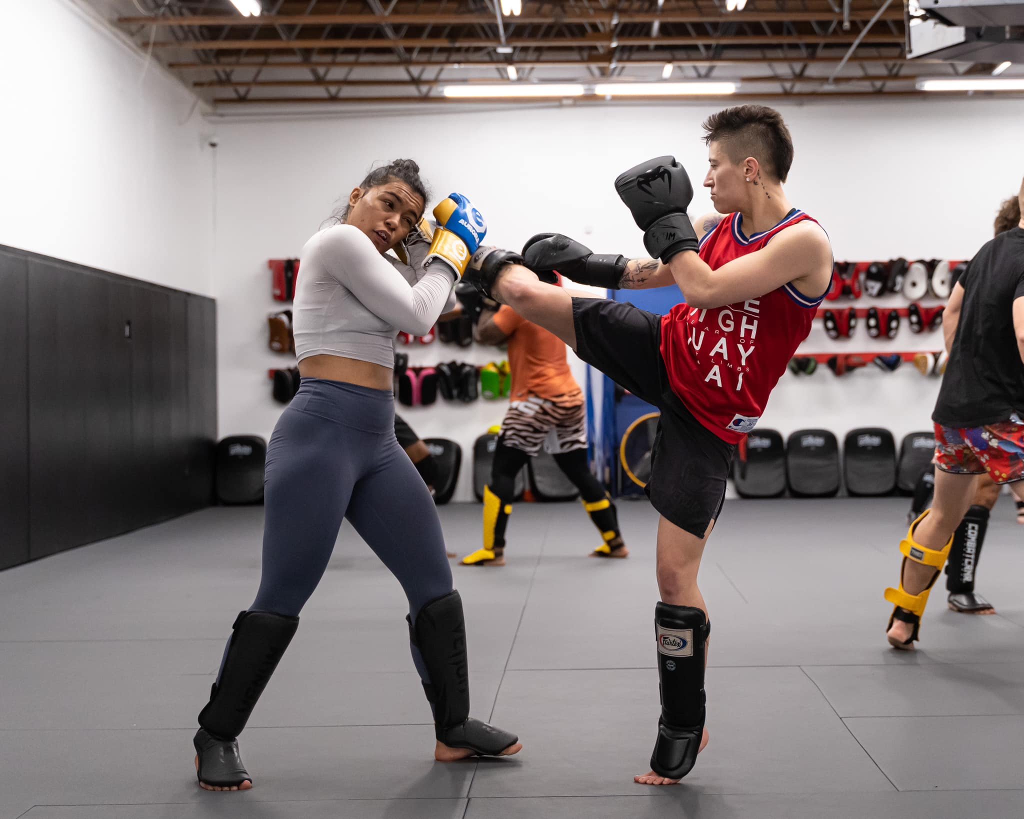 Premium Photo | Boxers training kickboxing in the ring