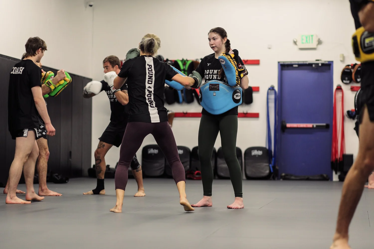 Adults training Muay Thai and K-1 kickboxing at Pound 4 Pound in Littleton, Colorado