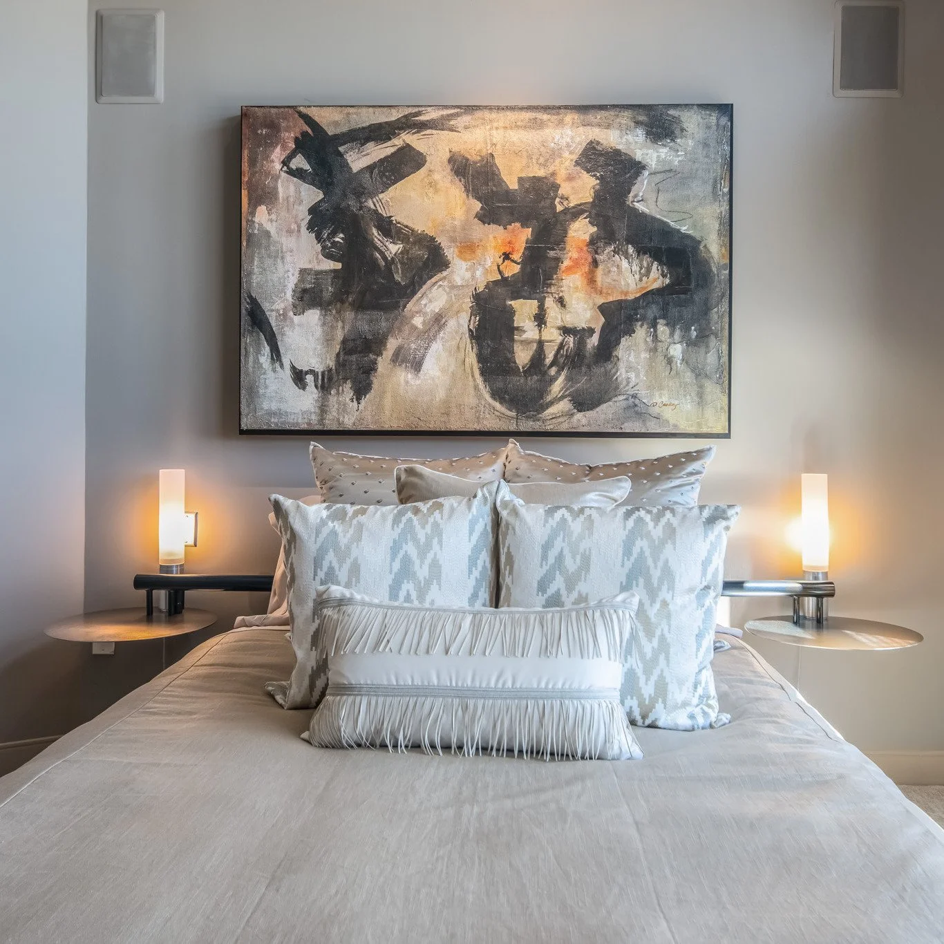 The pied de terre primary bedroom is designed with custom bedding and original fine art. 

The custom pillows are a combination of patterns, sizes and trims. 

Design is meant to be layered for visual depth and beauty.

#interiordesign
#interiordesig