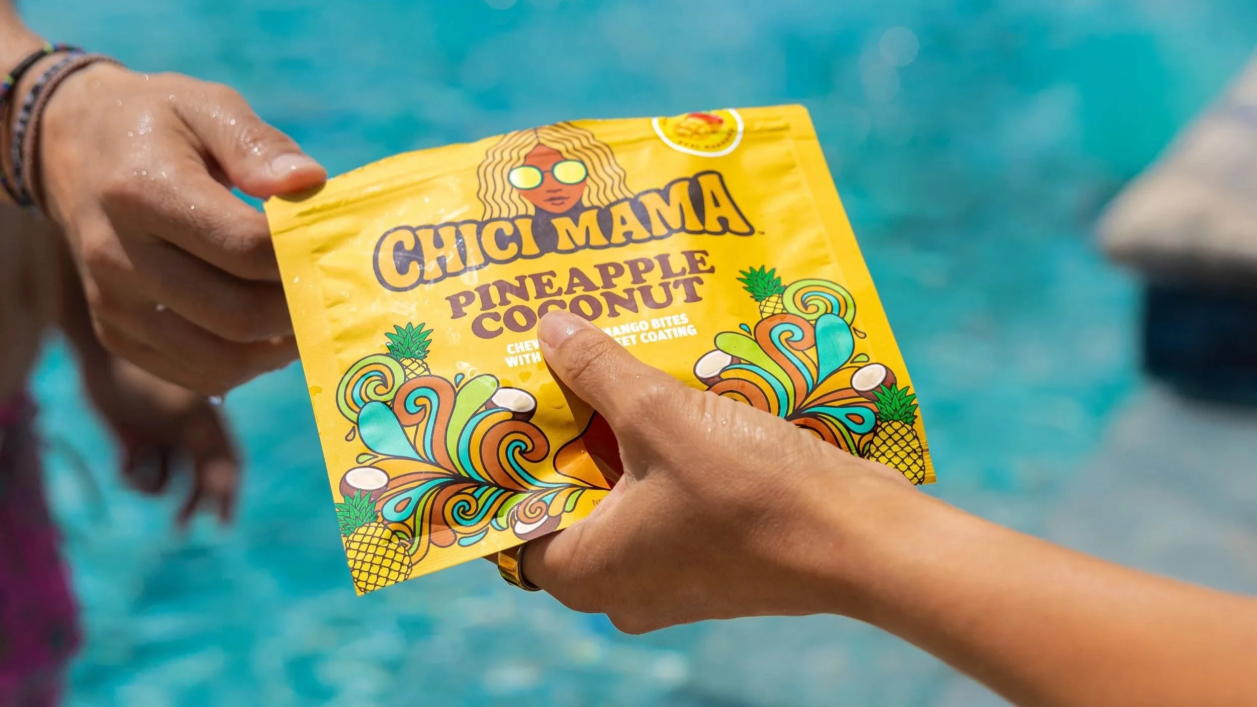 Hand holding Chici Mama Pineapple Coconut bag, food brand product photography by Gabe Gonzalez